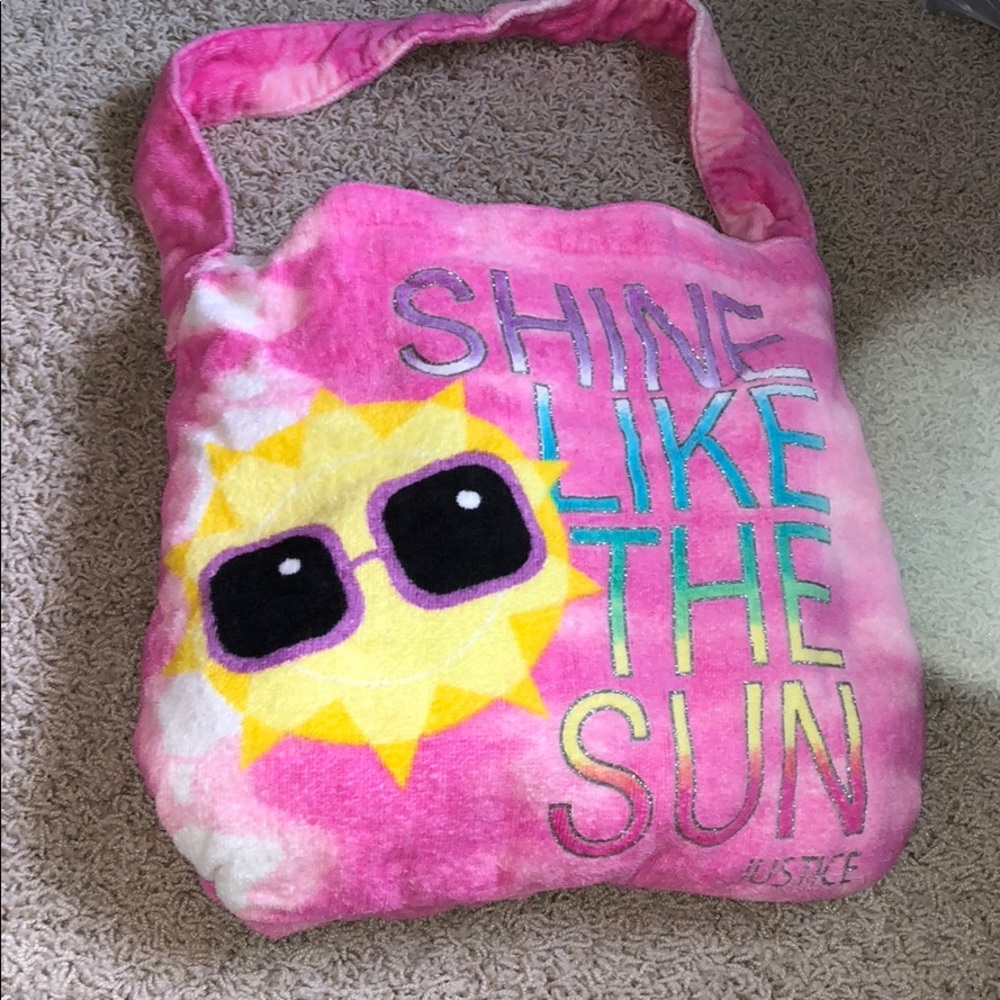 Towel that fold up into a purse